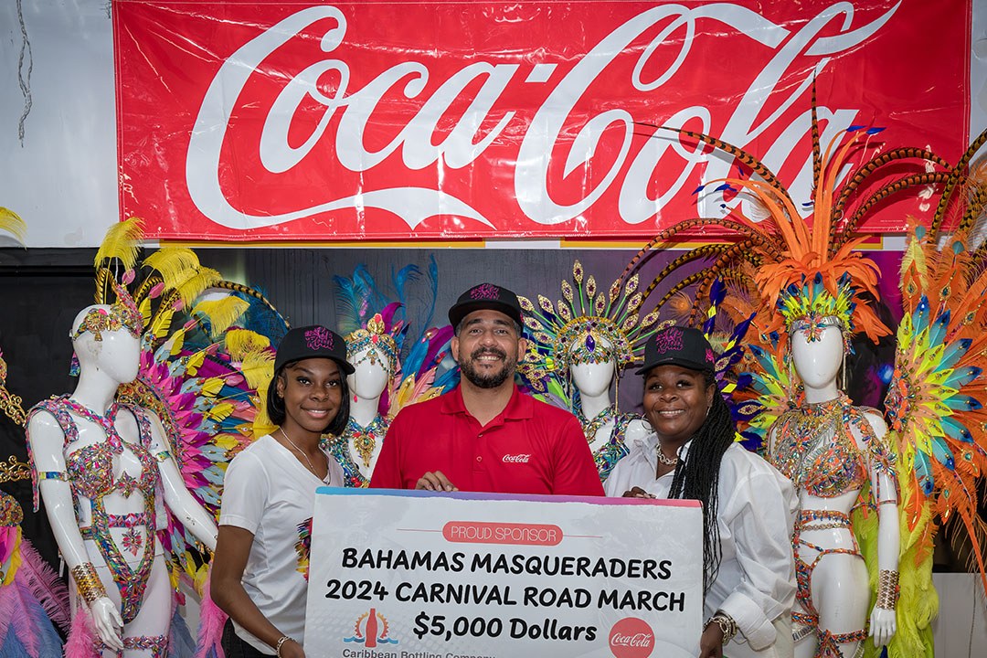 Caribbean Bottling Company presenting a community sponsorship cheque