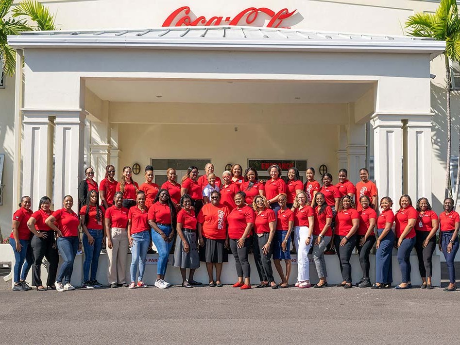 Caribbean Bottling Company team outside the Nassau plant entrance